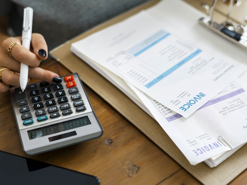 woman calculator invoice office